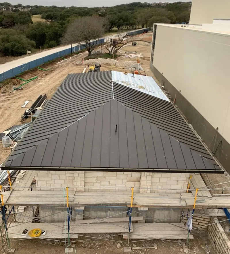 Metal roof new construction with scaffolding in Parma